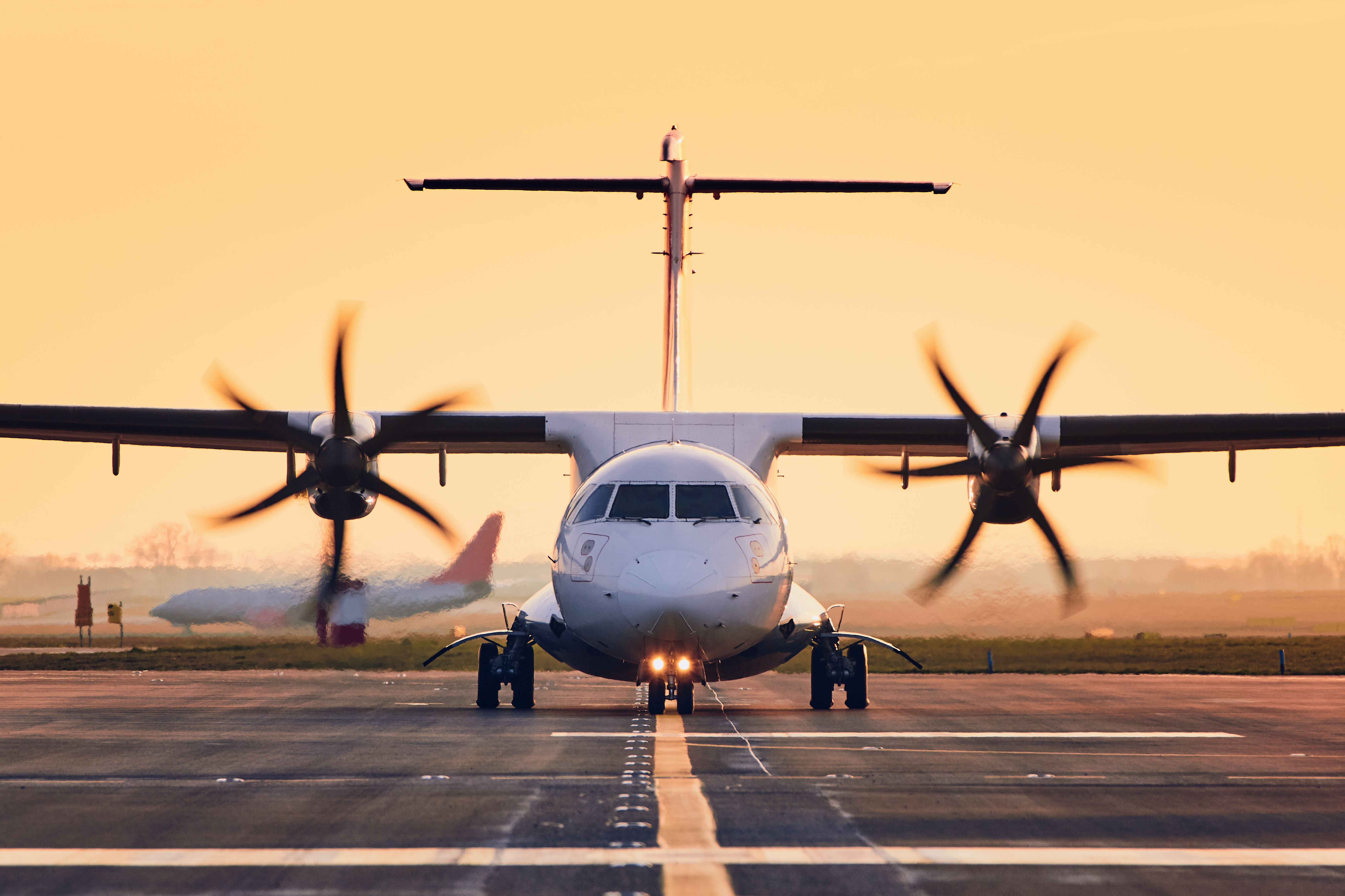 Aircraft on runway at dawn showcasing professional operations